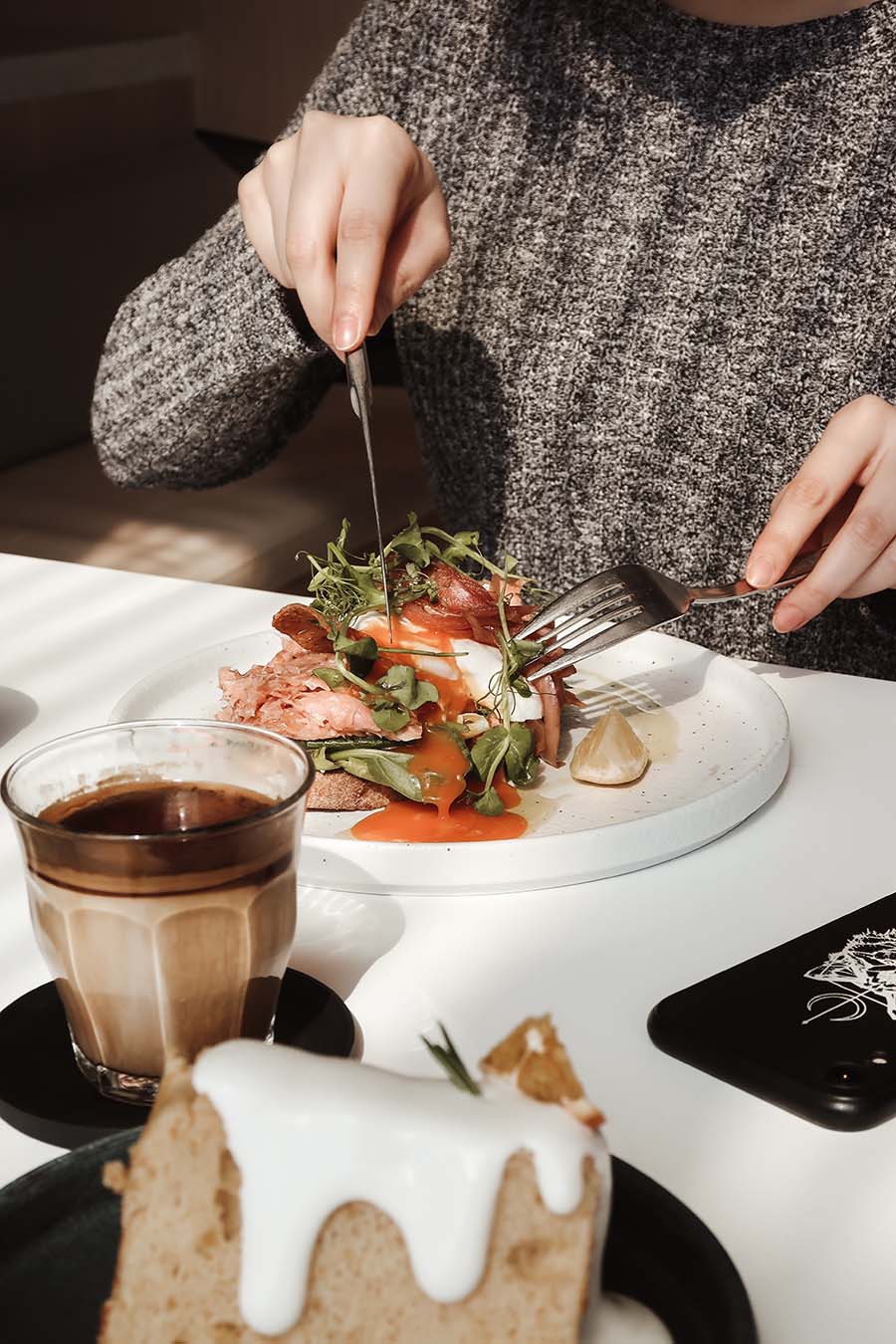 Woman cutting salad and cheese